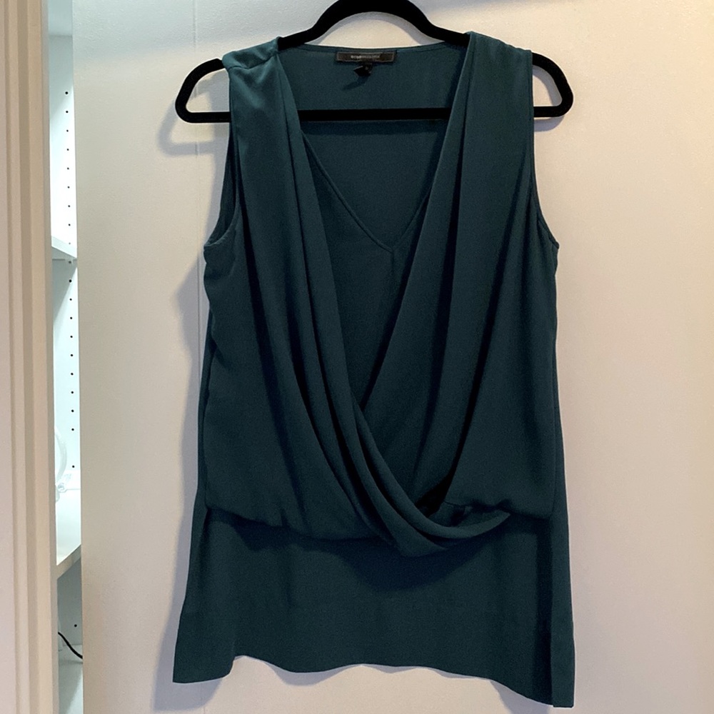 BCBG Maxazria blouse, good condition, 100% polyester. Size M.